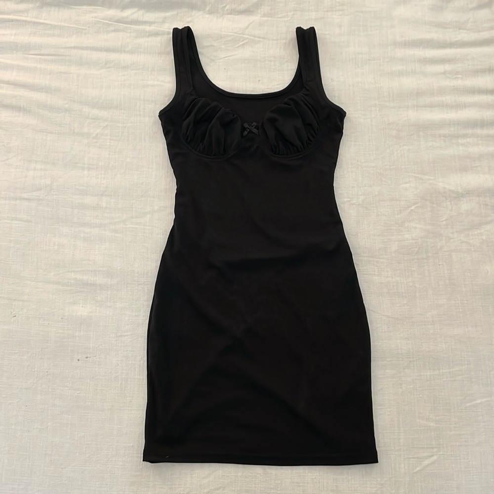 Black bodycon dress with ruched top and bow